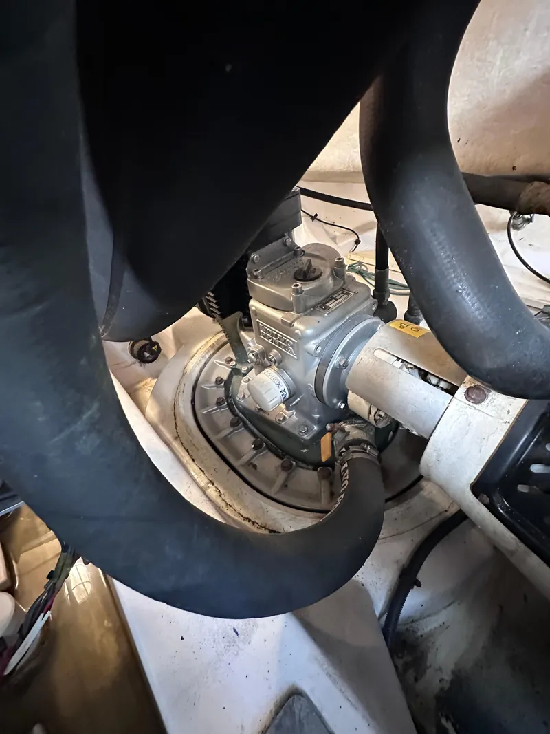 Slide: The Image of Engine compartment of a 2008 Four Winns V458 boat, showing mechanical components and hoses. - 46