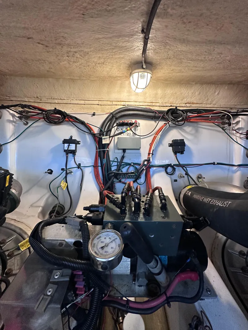 Slide: The Image of Engine room of 2008 Four Winns V458 boat with wiring and mechanical components. - 47