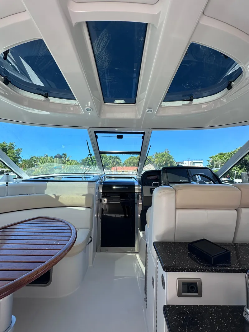 Slide: The Image of Interior of 2008 Four Winns V458 yacht with skylights and seating area. - 7