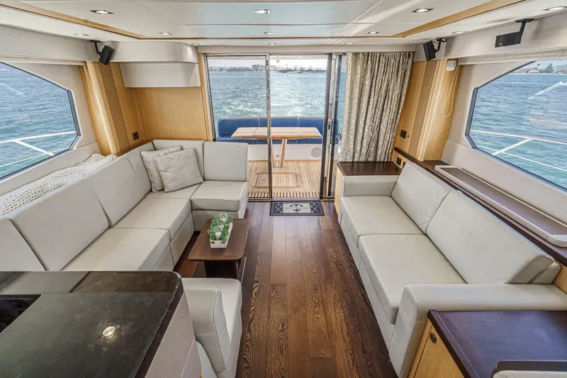 Slide: The Image of Luxurious interior of 2017 Sunseeker Manhattan 65 yacht with elegant seating and ocean view. - 17