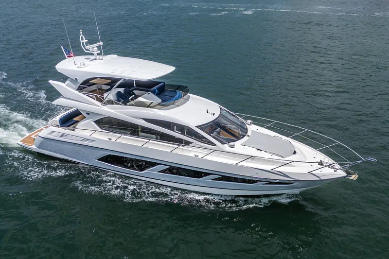 Slide: The Image of 2017 Sunseeker Manhattan 65 yacht cruising on open water. - 2