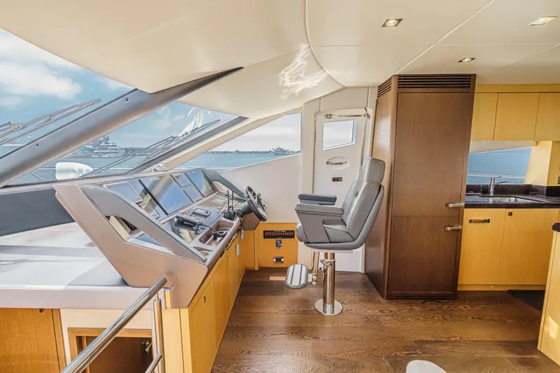 Slide: The Image of Luxurious 2017 Sunseeker Manhattan 65 yacht interior with modern helm and sleek design. - 27