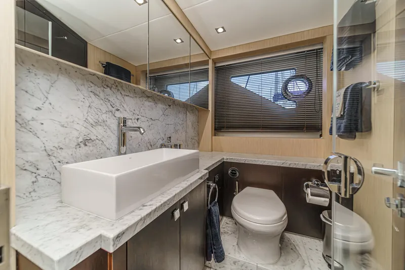 Slide: The Image of Luxurious bathroom in 2017 Sunseeker Manhattan 65 yacht with marble countertop and modern fixtures. - 36