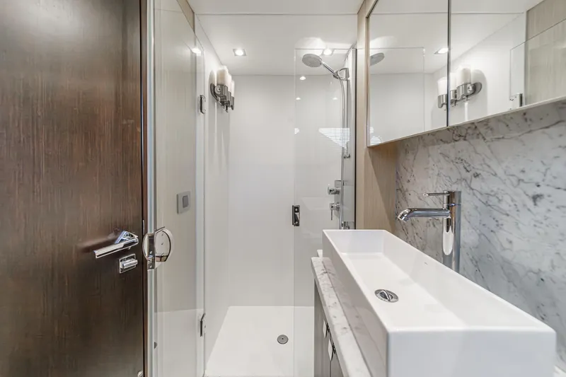 Slide: The Image of Luxurious bathroom in 2017 Sunseeker Manhattan 65 yacht with modern fixtures and marble accents. - 37