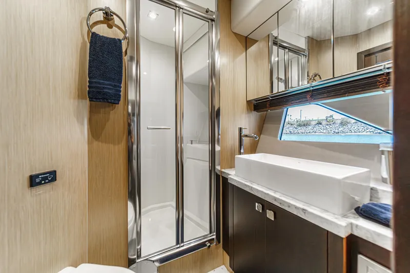 Slide: The Image of Luxurious bathroom in 2017 Sunseeker Manhattan 65 yacht with modern fixtures and ocean view. - 42