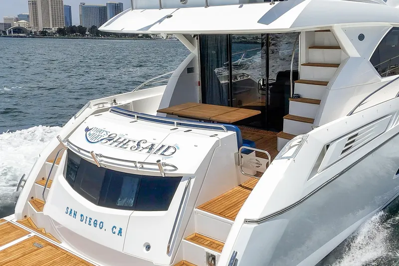 Slide: The Image of 2017 Sunseeker Manhattan 65 yacht cruising near San Diego skyline. - 9