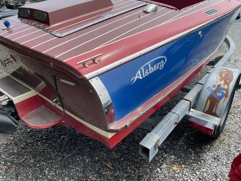 Slide: The Image of Red and blue Alsberg Brothers 17 boat on trailer, 2002 model, parked on gravel. - 4