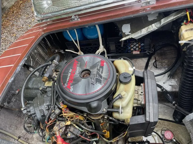 Slide: The Image of Engine compartment of a 2002 Alsberg Brothers model 17 boat, featuring a Jet 175 HP engine. - 8