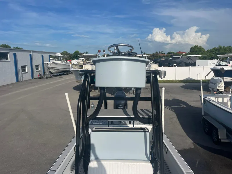 Slide: The Image of 1971 Aquasport 222 boat parked in a marina with clear blue skies. - 10