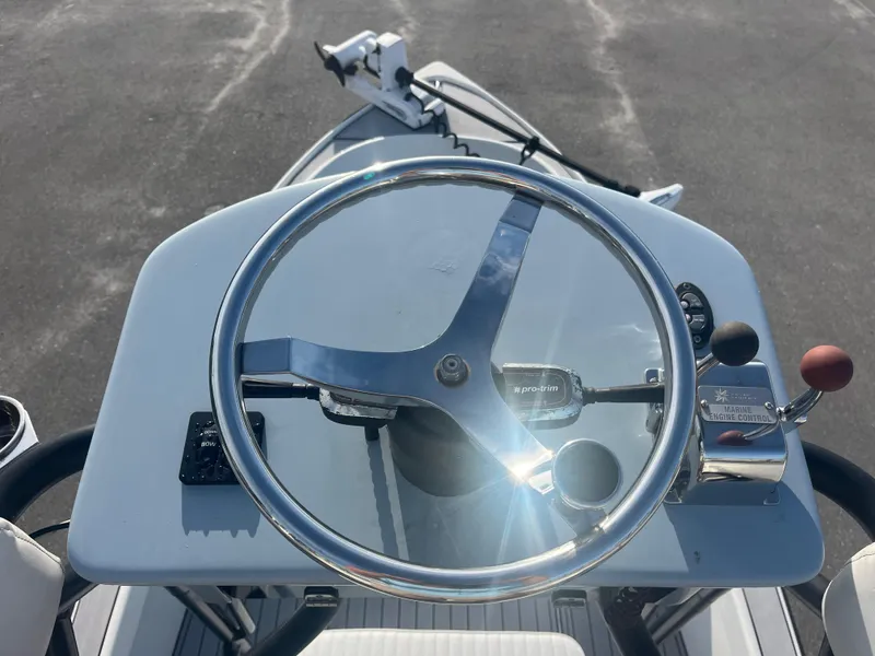 Slide: The Image of 1971 Aquasport 222 boat steering console with marine engine controls and pro-trim lever. - 11