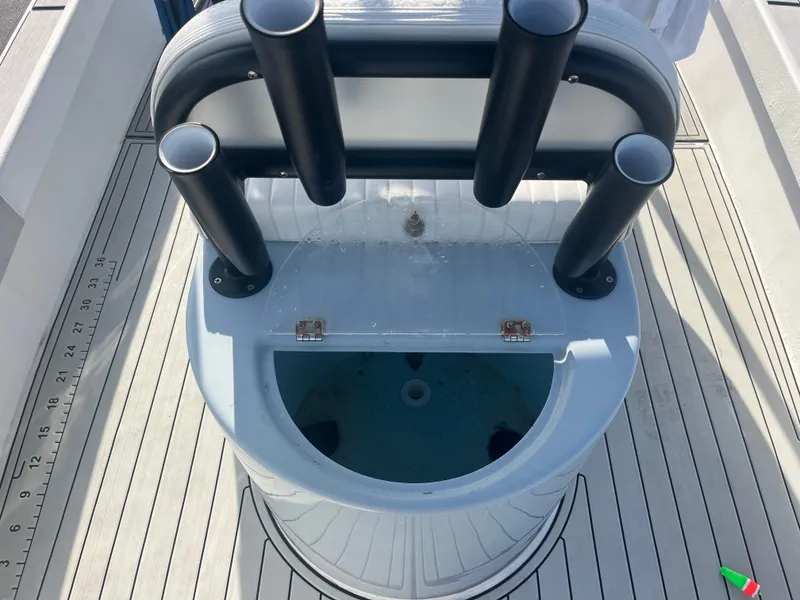 Slide: The Image of 1971 Aquasport 222 boat with rod holders and livewell on deck. - 13
