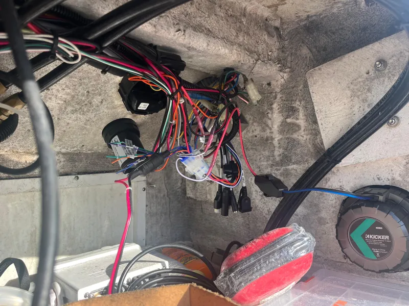 Slide: The Image of 1971 Aquasport 222 boat wiring and electronics, featuring colorful cables and a Kicker audio component. - 17