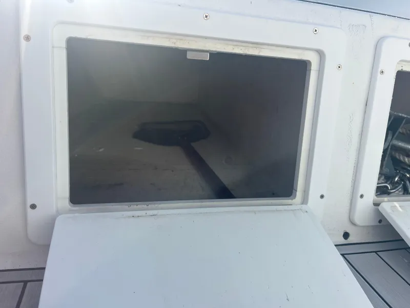 Slide: The Image of Open storage compartment on a 1971 Aquasport 222 boat, showing interior space. - 20