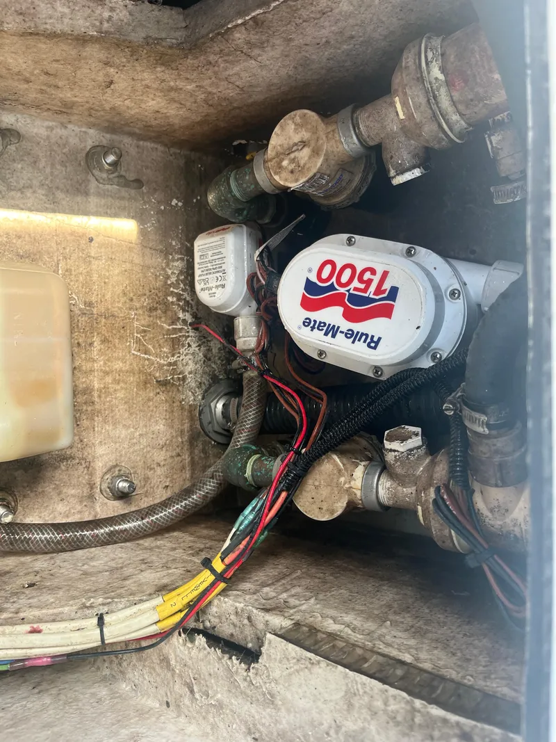 Slide: The Image of 1971 Aquasport 222 boat bilge area with Rule-Mate 1500 pump and wiring. - 23