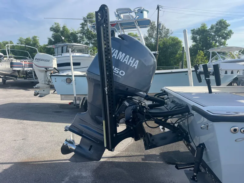 Slide: The Image of 1971 Aquasport 222 boat with Yamaha 150 outboard motor in a marina setting. - 5