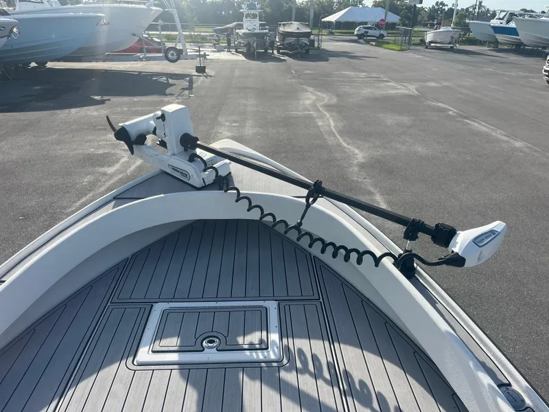 Slide: The Image of 1971 Aquasport 222 boat with trolling motor on deck, parked in a marina. - 7
