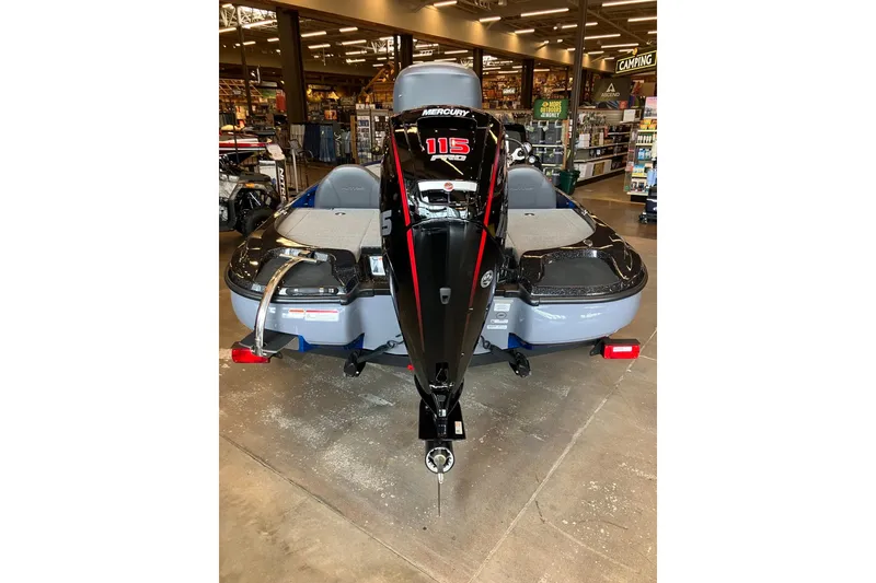 Slide: The Image of 2025 Nitro Z17 boat with Mercury 115 engine displayed indoors. - 3