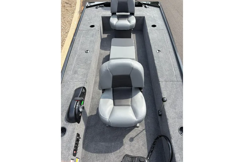 Slide: The Image of 2025 Tracker Panfish 17 boat interior with gray seating and carpeted deck. - 40