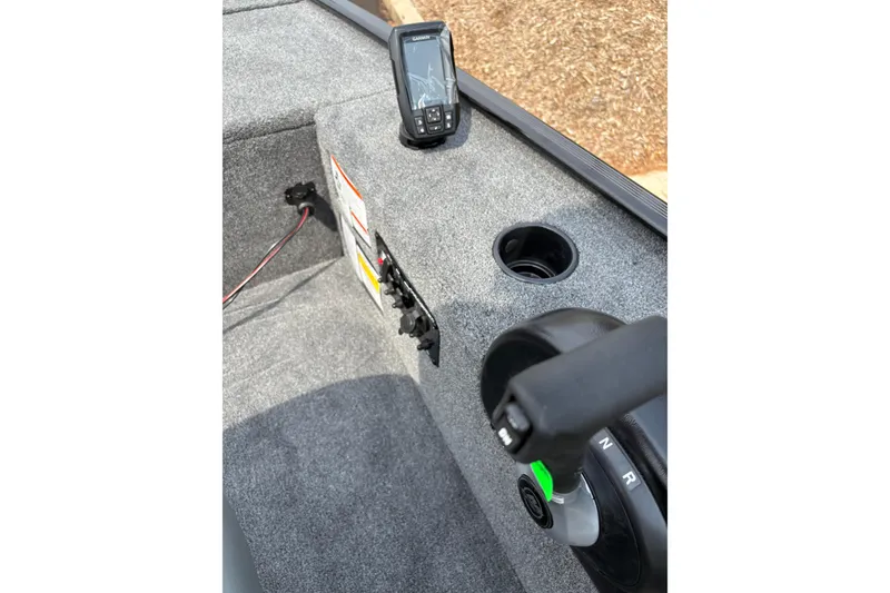 Slide: The Image of 2025 Tracker Panfish 17 boat interior with control panel and fish finder. - 41