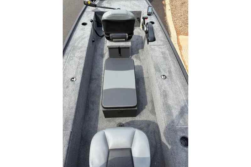 Slide: The Image of 2025 Tracker Panfish 17 boat interior with gray seating and carpeted flooring. - 42