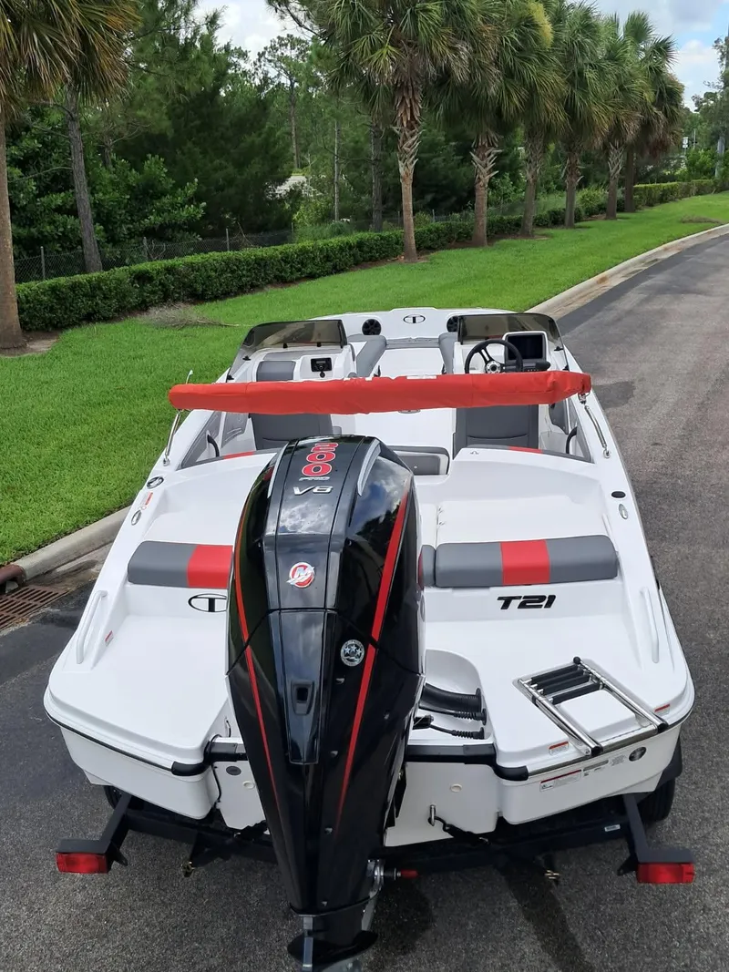 Slide: The Image of 2025 Tahoe T21 boat with powerful outboard motor, parked on a scenic road. - 4