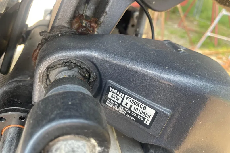 Slide: The Image of Close-up of Yamaha F350XCB engine part on 2015 Pursuit DC 265 Dual Console boat. - 13