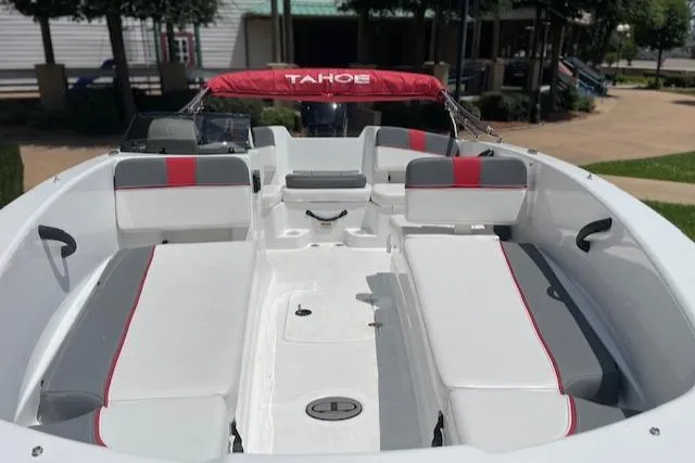 Slide: The Image of 2024 Tahoe T18 boat interior with red and gray seating, showcasing spacious design. - 2