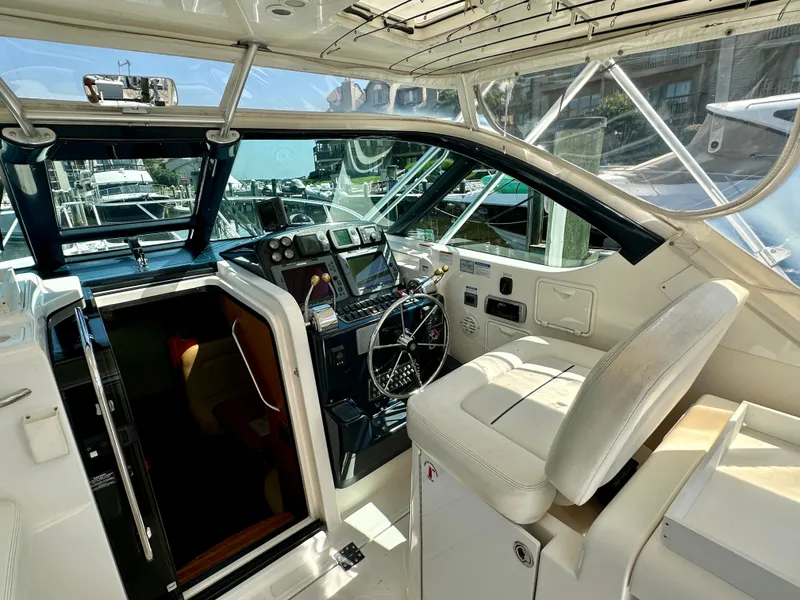 Slide: The Image of 2005 Tiara Yachts 3600 Open cockpit with steering wheel and navigation equipment. - 16