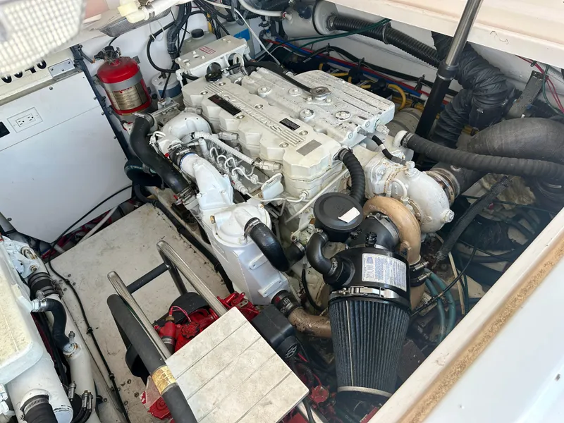 Slide: The Image of Engine compartment of a 2005 Tiara Yachts 3600 Open, showcasing detailed mechanical components. - 27