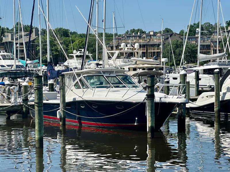 Slide: The Image of 2005 Tiara Yachts 3600 Open docked in marina, clear blue sky background. - 4