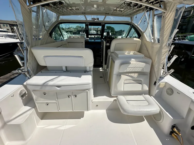 Slide: The Image of 2005 Tiara Yachts 3600 Open docked, featuring spacious seating and sleek design. - 7