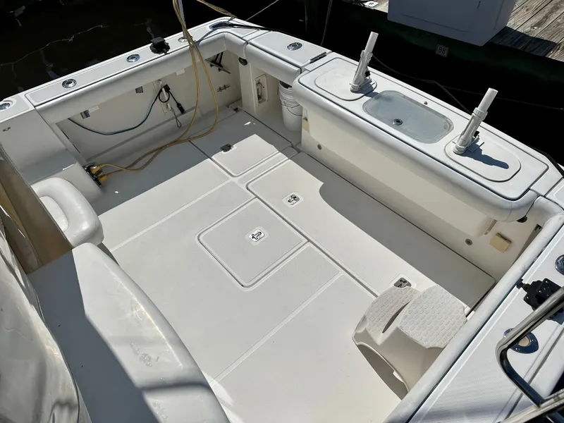 Slide: The Image of 2005 Tiara Yachts 3600 Open interior with white seating and helm station. - 8