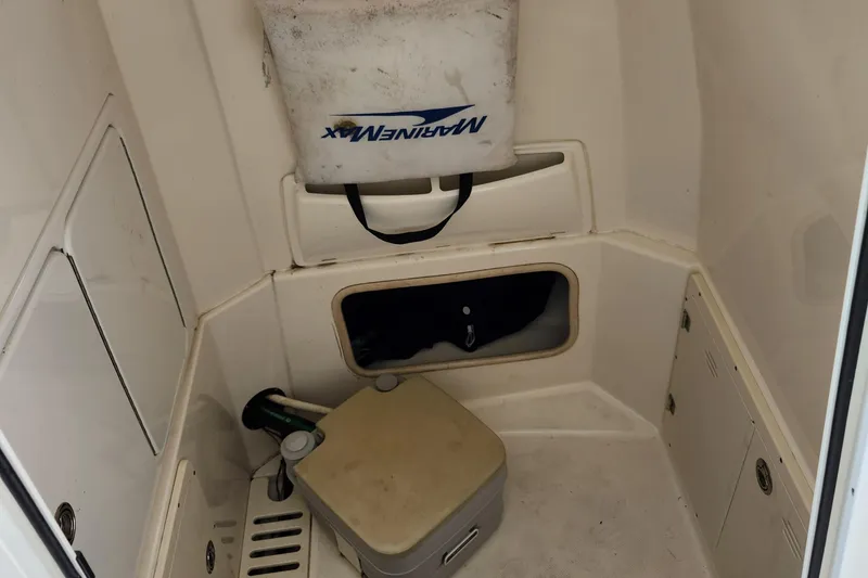 Slide: The Image of Interior cabin of 2014 Boston Whaler 250 Outrage with storage and equipment. - 10