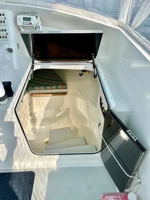 Slide: The Image of 2008 Buddy Cannady 28 Custom Express boat cabin entrance with open hatch. - 12