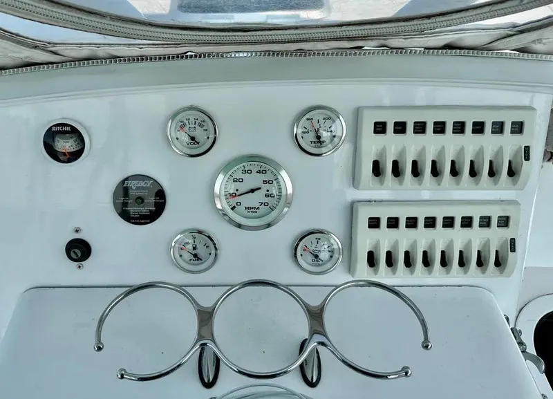 Slide: The Image of Dashboard of 2008 Buddy Cannady 28 Custom Express with gauges and switches. - 19