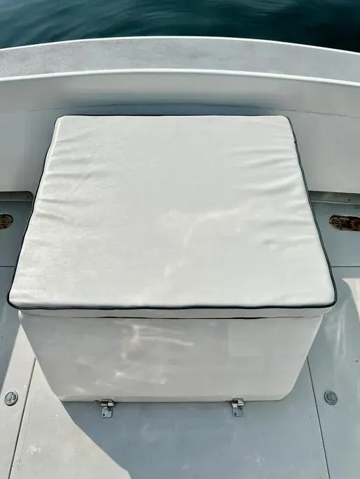 Slide: The Image of White cushioned seat on 2008 Buddy Cannady 28 Custom Express boat deck. - 30