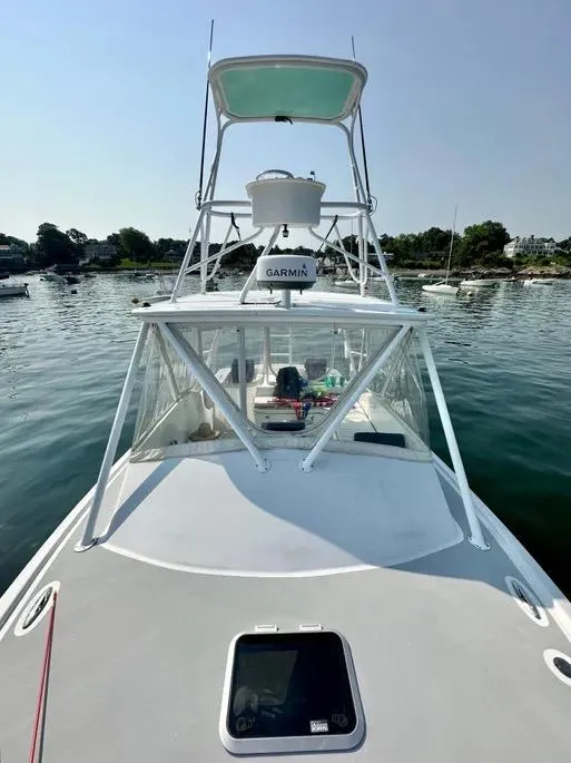 Slide: The Image of 2008 Buddy Cannady 28 Custom Express boat on calm water, featuring Garmin equipment. - 7