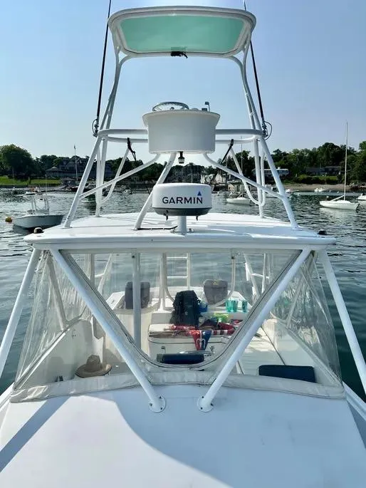 Slide: The Image of 2008 Buddy Cannady 28 Custom Express boat with Garmin equipment on calm water. - 8
