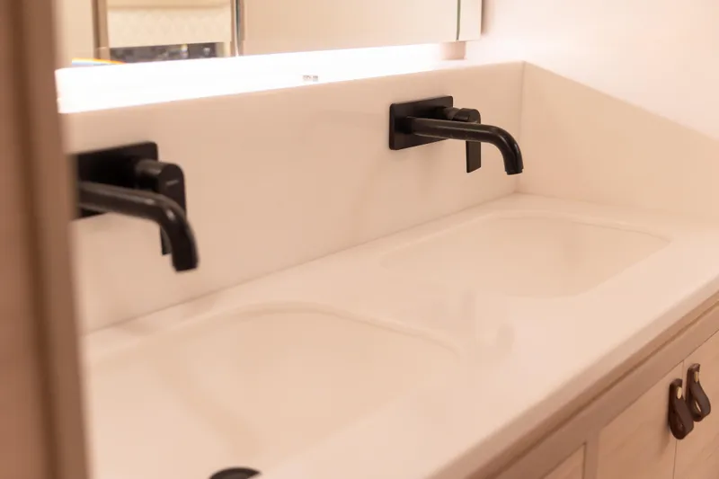 Slide: The Image of Modern double sink with black faucets in a Knysna 550, 2026 model. - 6