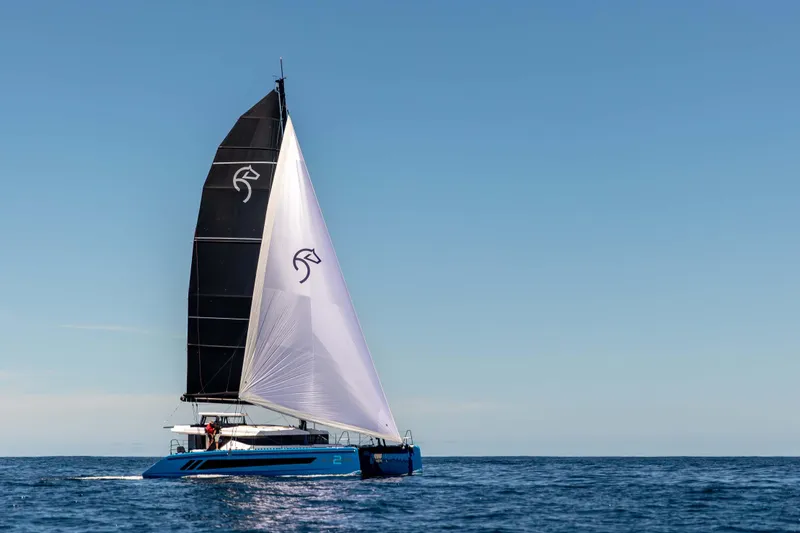 Slide: The Image of Sailing yacht Knysna 550, 2026 model, gliding on open sea under clear blue sky. - 7