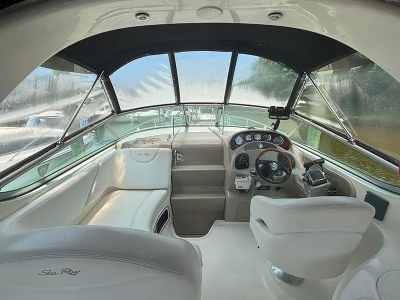Slide: The Image of Interior of 2007 Sea Ray 280 Sundancer boat with helm and seating area. - 12