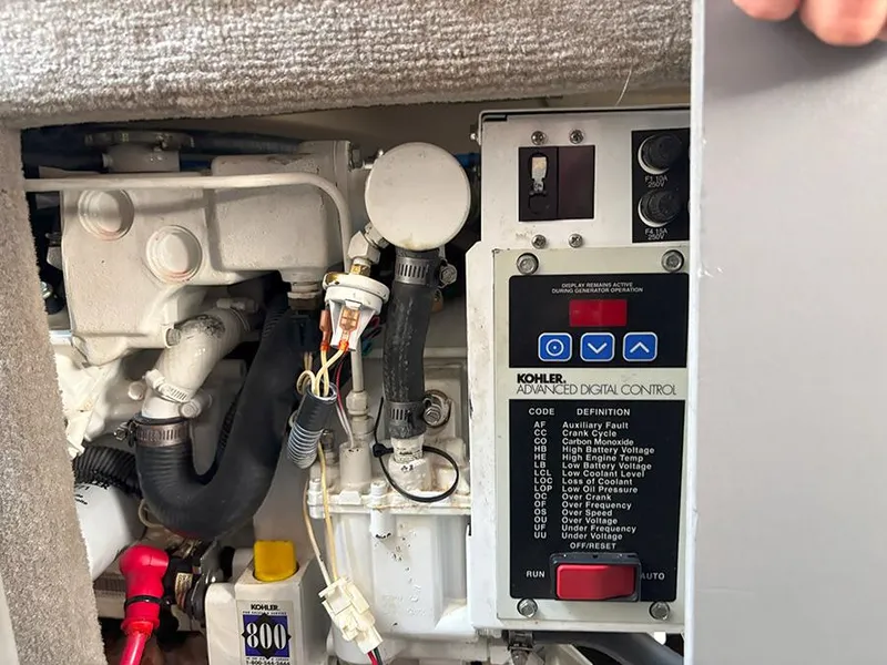 Slide: The Image of Engine compartment of a 2007 Sea Ray 280 Sundancer with Kohler digital control panel. - 23