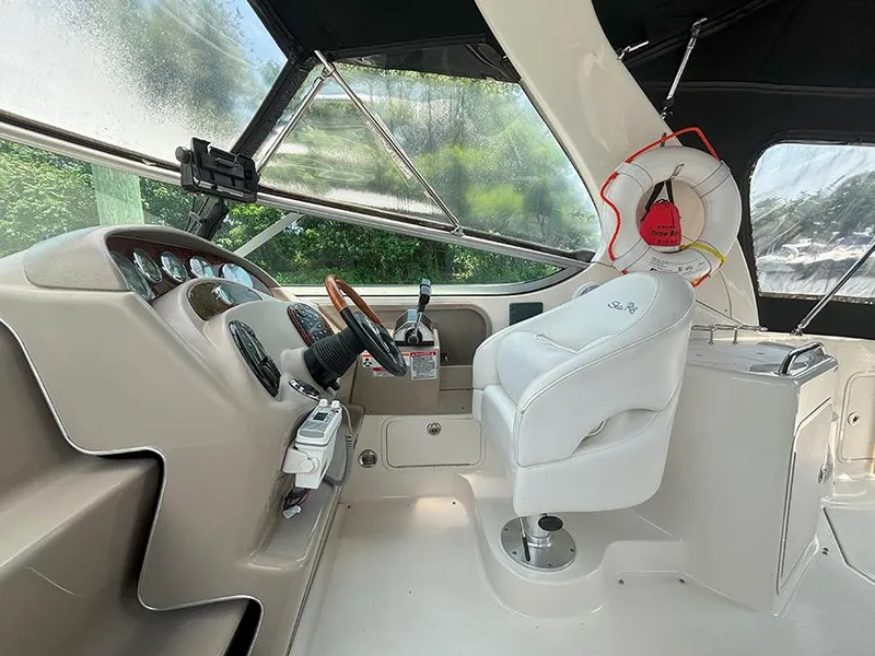Slide: The Image of Interior cockpit of 2007 Sea Ray 280 Sundancer with steering wheel and control panel. - 8