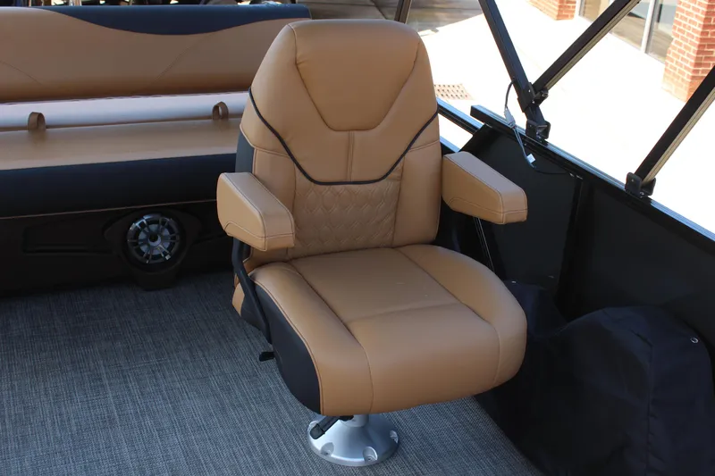 Slide: The Image of 2025 Tahoe Pontoon LTZ Versatile Rear Lounger with tan captain's chair and armrests. - 11