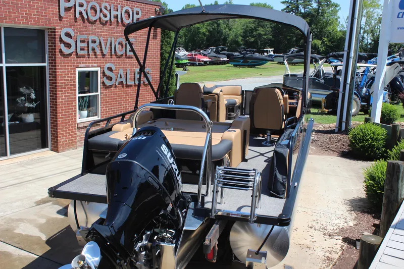 Slide: The Image of 2025 Tahoe Pontoon LTZ Versatile Rear Lounger at dealership, showcasing sleek design and powerful engine. - 5