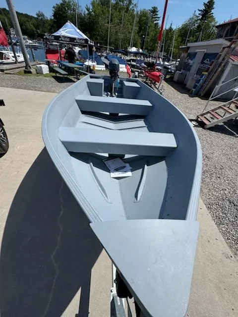 Slide: The Image of 2025 G3 Guide V16 XT boat displayed outdoors at a marina. - 5