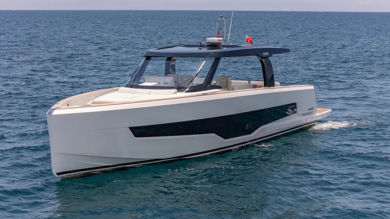 Slide: The Image of 2023 Fjord 53XL yacht cruising on open sea. - 2