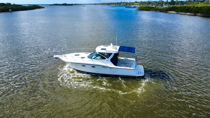 Slide: The Image of 2006 Tiara Yachts 3200 Open cruising on a calm river. - 11