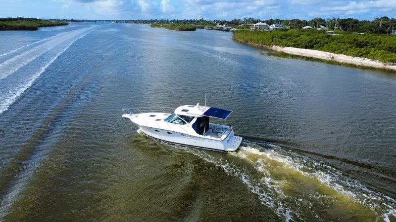 Slide: The Image of 2006 Tiara Yachts 3200 Open cruising on a scenic waterway. - 12