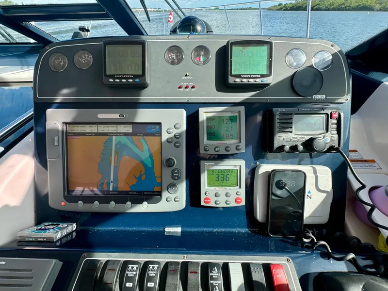 Slide: The Image of Control panel of a 2006 Tiara Yachts 3200 Open with navigation and communication equipment. - 29